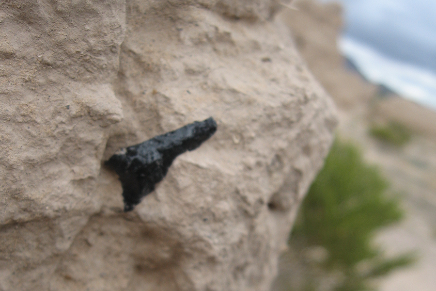 Projectile point in adobe wall